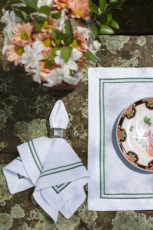 White linen napkin with double green roll