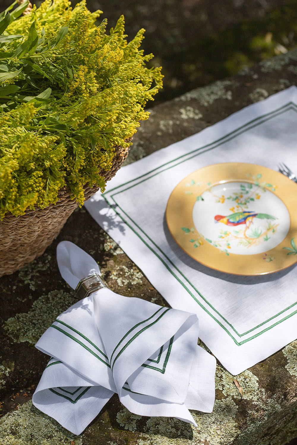 White linen napkin with double green roll