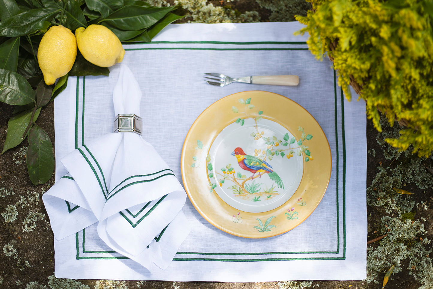 White linen napkin with double green roll